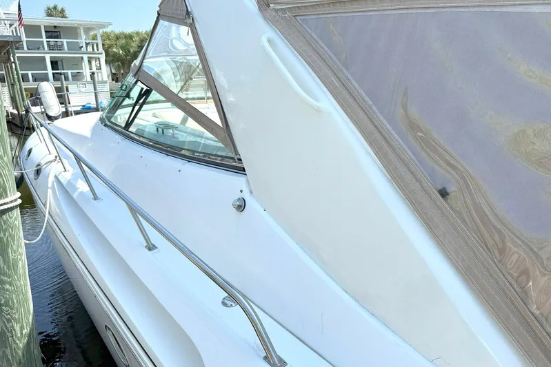 Creme Brulee Yacht Photos Pics 2001 Cruisers Yachts 4270 Express docked, showcasing sleek design and white exterior.