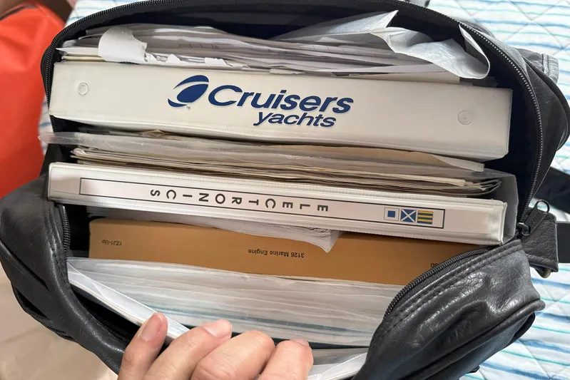 Creme Brulee Yacht Photos Pics Bag containing Cruisers Yachts 4270 Express 2001 manuals and documents.