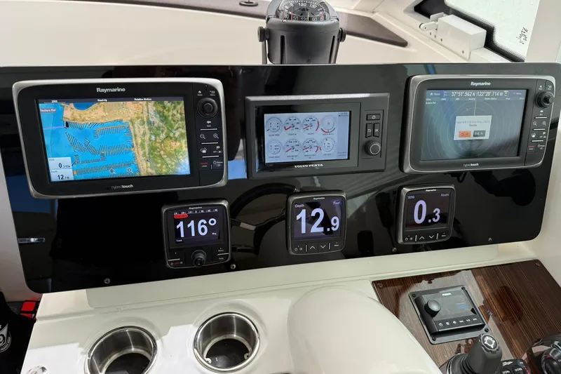 Osa Yacht Photos Pics 2012 Cruisers Yachts 41 Cantius dashboard with navigation and control displays.