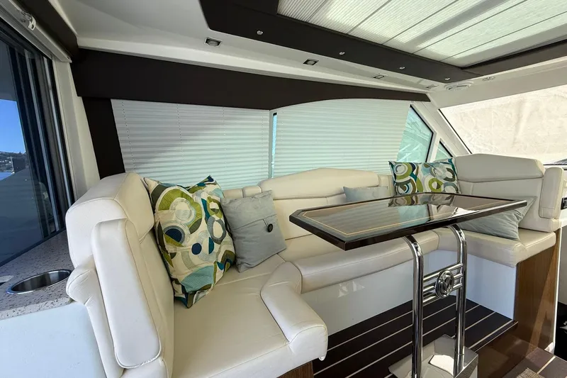 Osa Yacht Photos Pics Luxurious interior of 2012 Cruisers Yachts 41 Cantius with plush seating and modern decor.