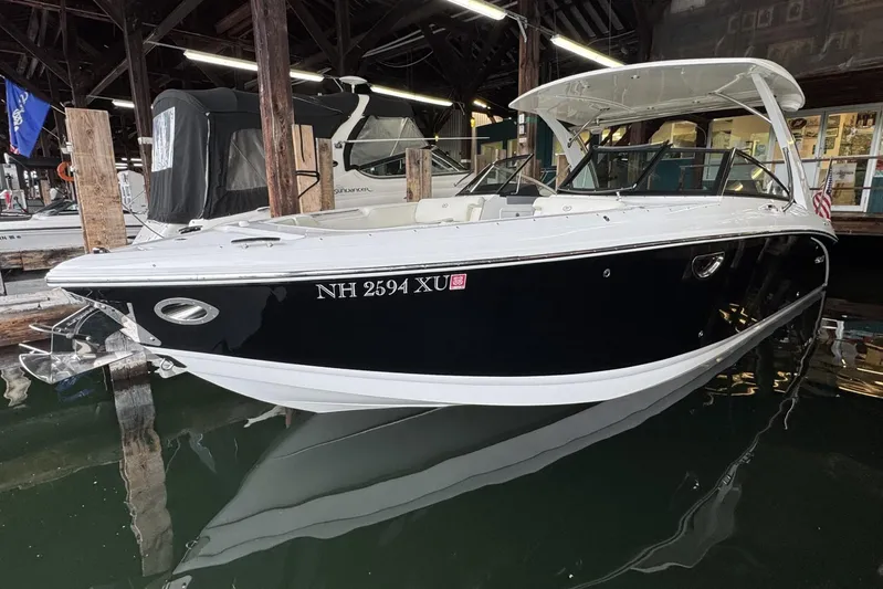  Yacht Photos Pics 2021 Cobalt R30 boat docked in marina, sleek black and white design.