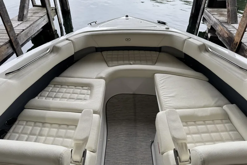  Yacht Photos Pics Luxurious seating area on a 2021 Cobalt R30 boat, docked by wooden piers.