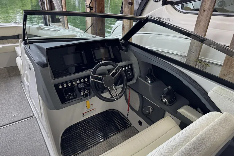  Yacht Photos Pics 2021 Cobalt R30 boat interior with modern dashboard and steering wheel.