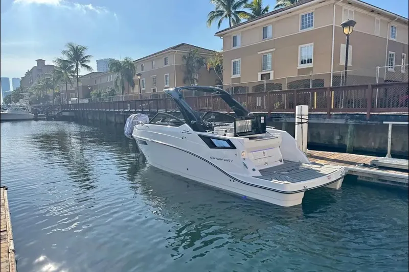  Yacht Photos Pics 2026 Granfort 300 GTS boat docked in a sunny canal with palm trees.