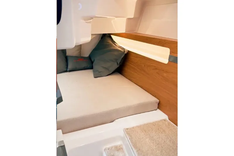  Yacht Photos Pics Interior cabin of 2026 Granfort 300 GTS, featuring cozy bedding and ambient lighting.