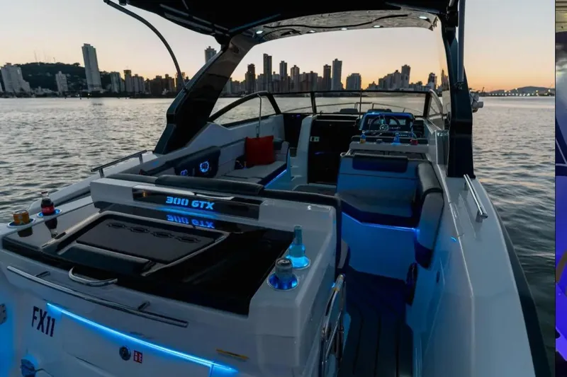  Yacht Photos Pics Luxury Granfort 300 GTS boat at sunset, city skyline in background, 2026 model.