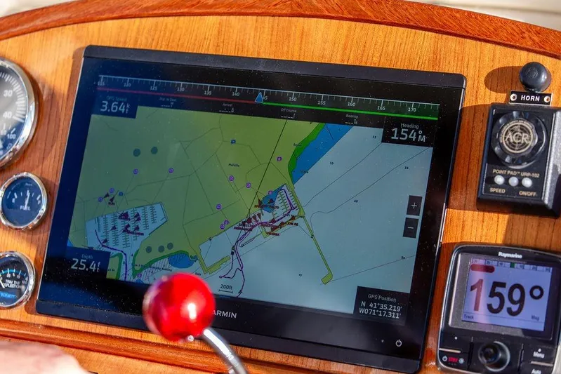 Wayfarer Yacht Photos Pics Navigation dashboard of a 2002 Hinckley Talaria 29C with GPS and speed instruments.