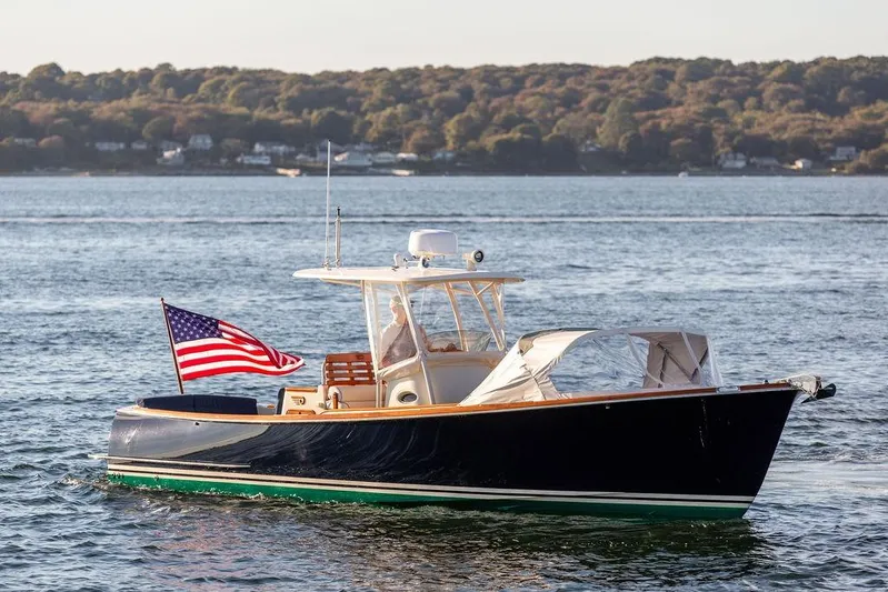 Wayfarer Yacht Photos Pics 2002 Hinckley Talaria 29C boat on water with American flag, scenic background.