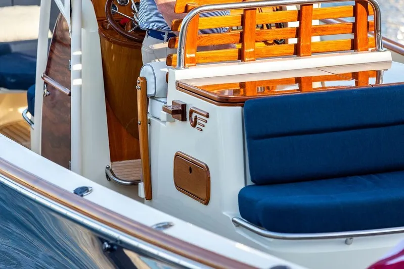 Wayfarer Yacht Photos Pics 2002 Hinckley Talaria 29C boat with wooden accents and blue seating.