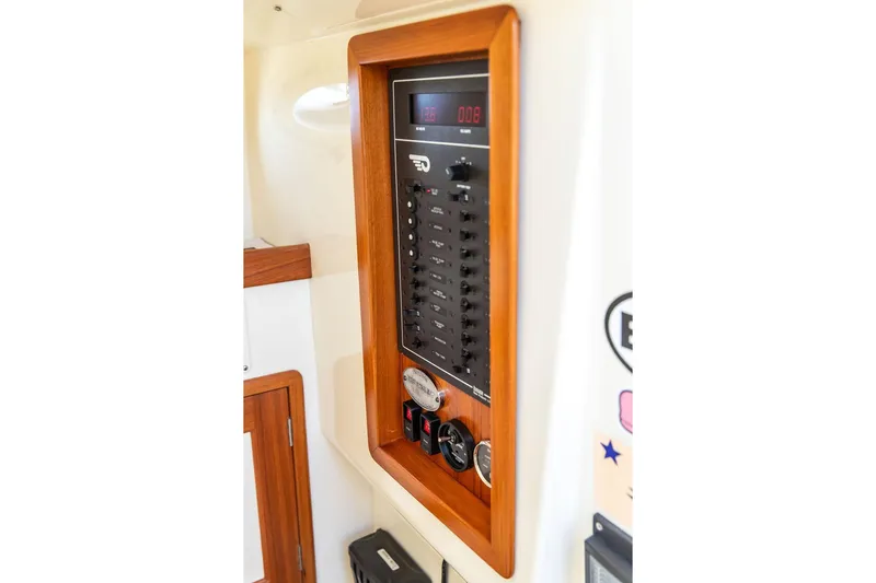 Wayfarer Yacht Photos Pics Control panel of a 2002 Hinckley Talaria 29C boat, featuring switches and gauges.