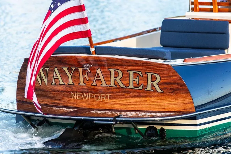 Wayfarer Yacht Photos Pics Hinckley Talaria 29C boat, 2002 model, with "Wayfarer" name and American flag, on water.