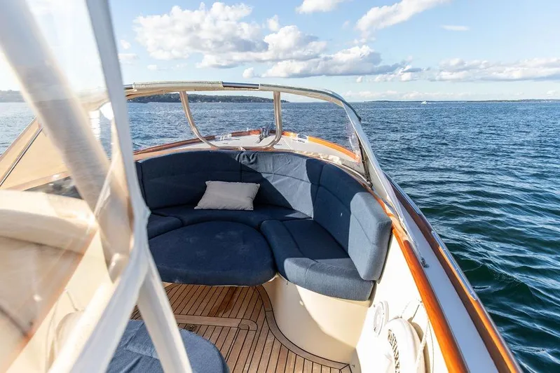 Wayfarer Yacht Photos Pics Hinckley Talaria 29C 2002 boat interior with blue seating on open water.