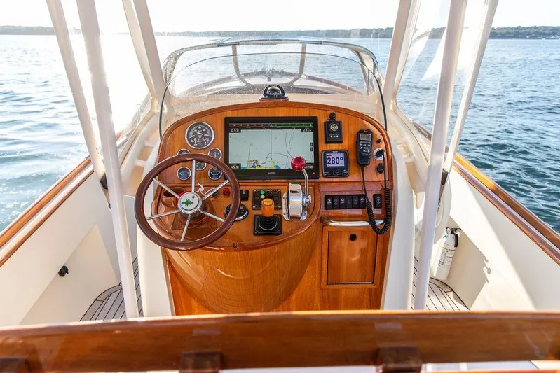 Wayfarer Yacht Photos Pics Helm of 2002 Hinckley Talaria 29C boat with wooden dashboard and navigation equipment.