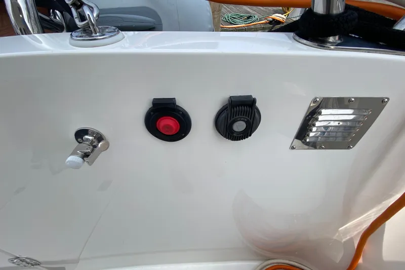 Emilie B Yacht Photos Pics Control panel on a 2003 American Tug 34 boat, featuring switches and vents.