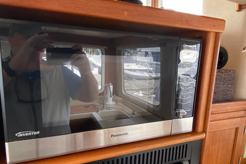 Emilie B Yacht Photos Pics Panasonic microwave in 2003 American Tug 34 kitchen interior.