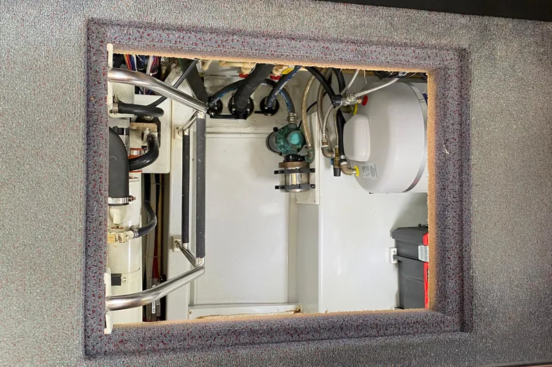 Emilie B Yacht Photos Pics Engine compartment of a 2003 American Tug 34, showcasing mechanical components and wiring.