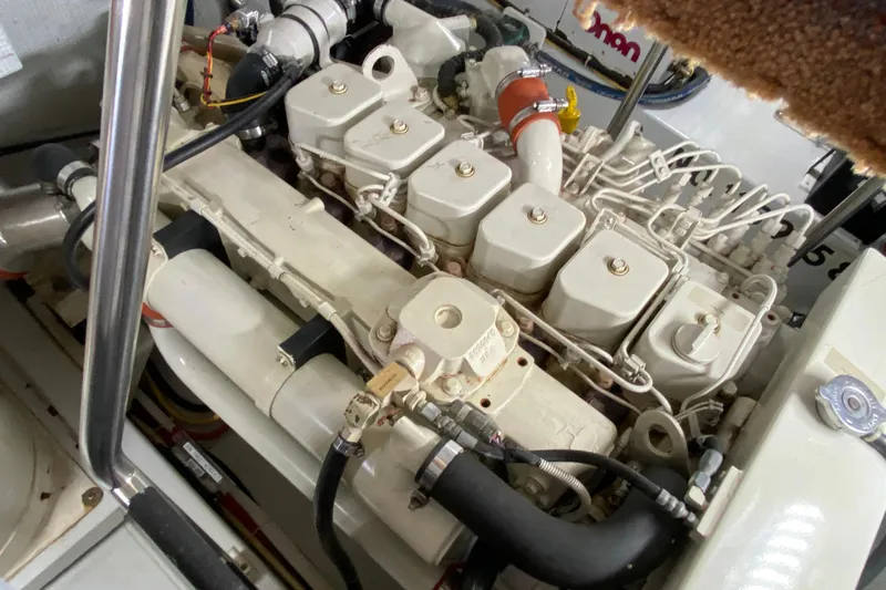 Emilie B Yacht Photos Pics Engine compartment of a 2003 American Tug 34, showcasing detailed mechanical components.