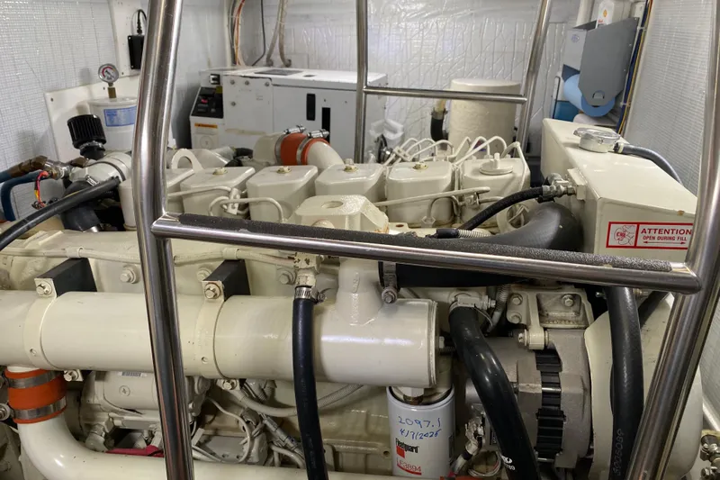 Emilie B Yacht Photos Pics Engine room of a 2003 American Tug 34, showcasing detailed mechanical components.