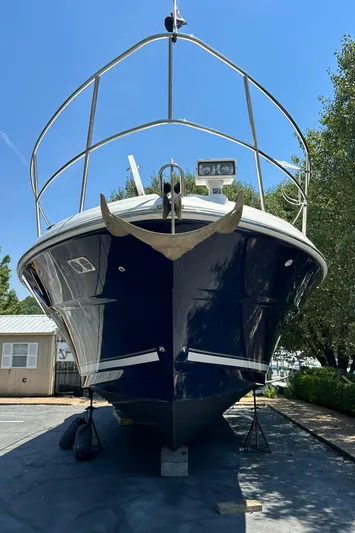  Yacht Photos Pics 2004 Sea Ray 390 Sundancer boat on dry dock, front view.