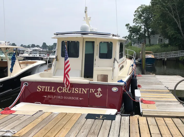  Yacht Photos Pics 2009 Sabre 40 Sedan docked at Milford Harbor with American flag.