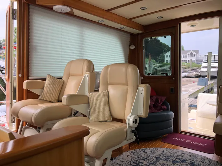  Yacht Photos Pics Interior of 2009 Sabre 40 Sedan yacht with beige leather seats and wooden accents.