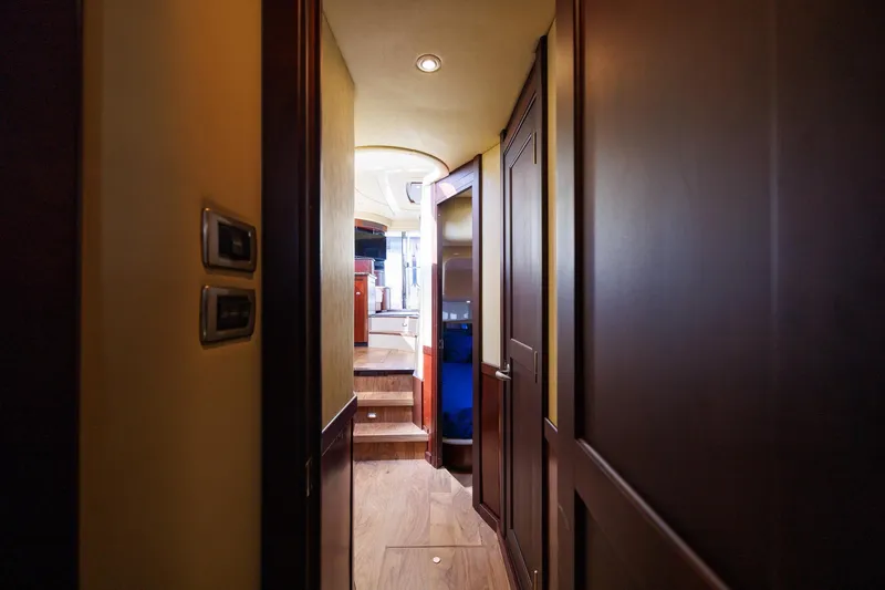 Zoe Grace Yacht Photos Pics Interior hallway of 2006 Sea Ray 52 Sedan Bridge yacht with wooden finishes.