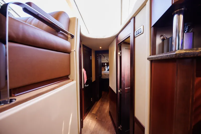 Zoe Grace Yacht Photos Pics Luxurious interior of 2006 Sea Ray 52 Sedan Bridge yacht, featuring elegant wood finishes.