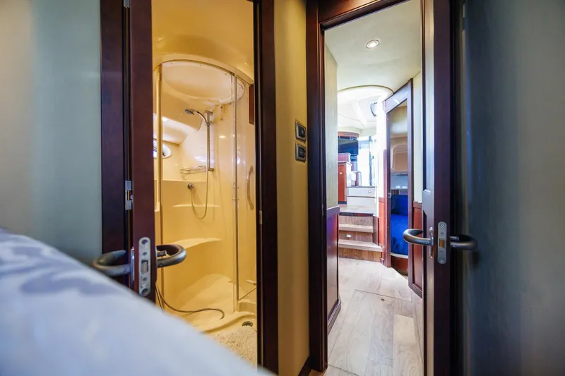 Zoe Grace Yacht Photos Pics Interior of 2006 Sea Ray 52 Sedan Bridge yacht, featuring a bathroom and hallway.