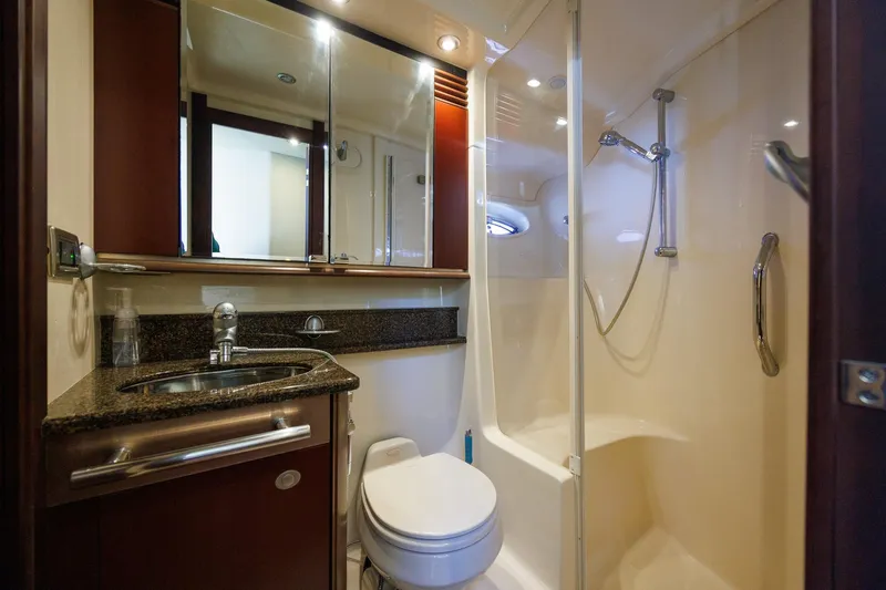 Zoe Grace Yacht Photos Pics Luxurious bathroom in 2006 Sea Ray 52 Sedan Bridge yacht with shower and vanity.
