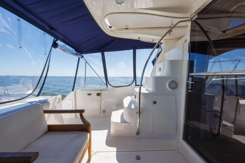 Zoe Grace Yacht Photos Pics 2006 Sea Ray 52 Sedan Bridge yacht interior with ocean view and seating area.