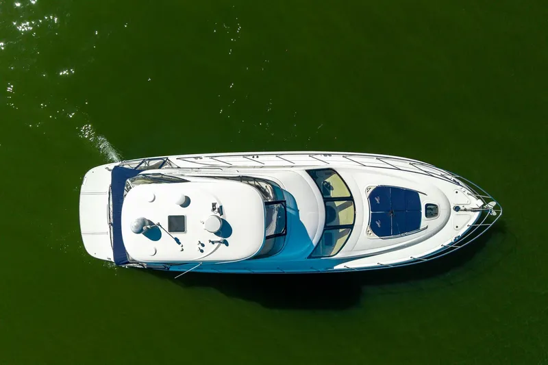 Zoe Grace Yacht Photos Pics Aerial view of 2006 Sea Ray 52 Sedan Bridge yacht on green water.