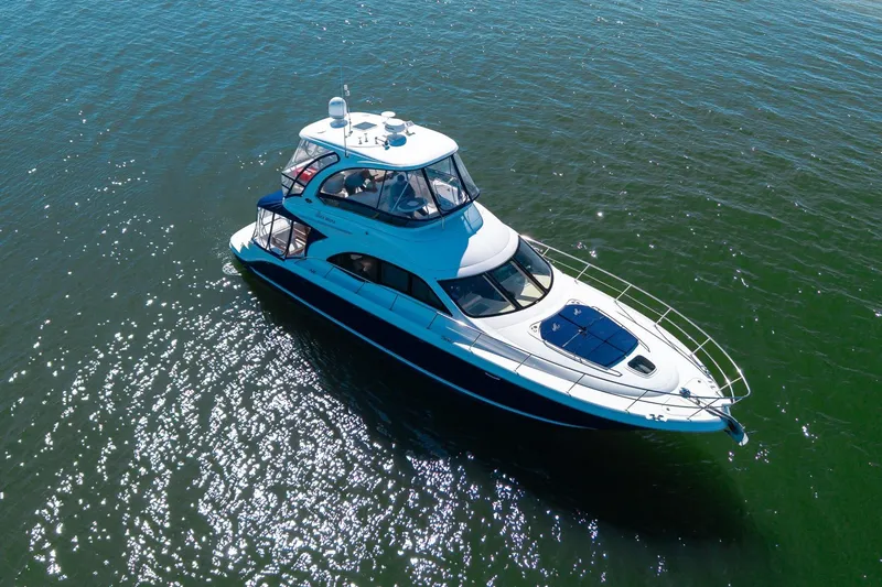 Zoe Grace Yacht Photos Pics 2006 Sea Ray 52 Sedan Bridge yacht cruising on open water.