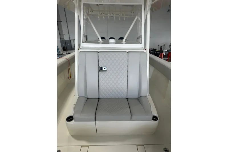 Yacht Photos Pics 2022 SeaVee 370Z boat with gray cushioned seating and white console.