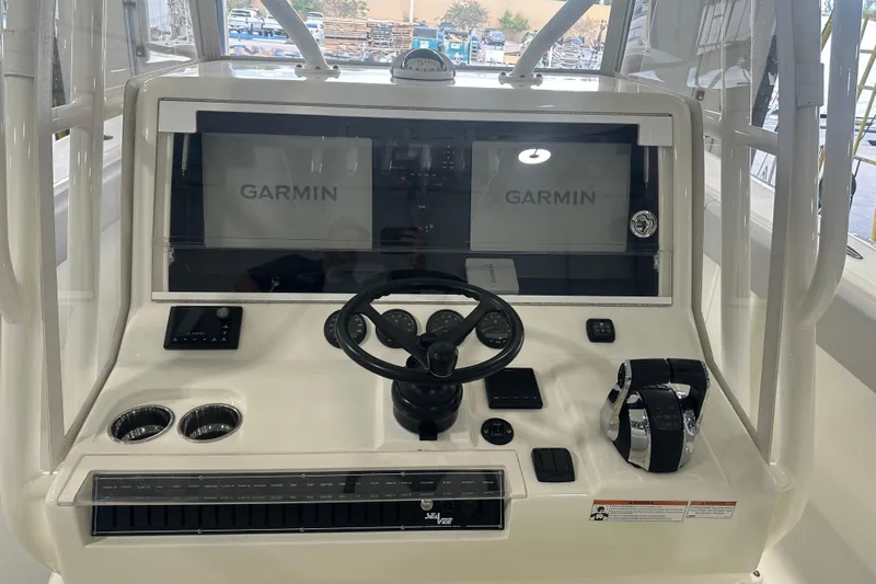  Yacht Photos Pics 2022 SeaVee 370Z boat dashboard with Garmin displays and steering wheel.