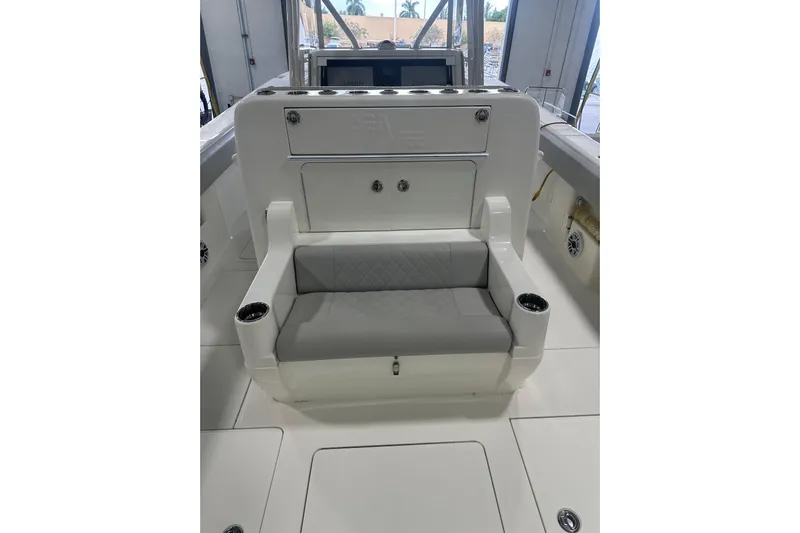  Yacht Photos Pics 2022 SeaVee 370Z boat interior with cushioned seating and cup holders.