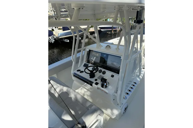  Yacht Photos Pics 2022 SeaVee 370Z boat console with Garmin navigation system and steering wheel.