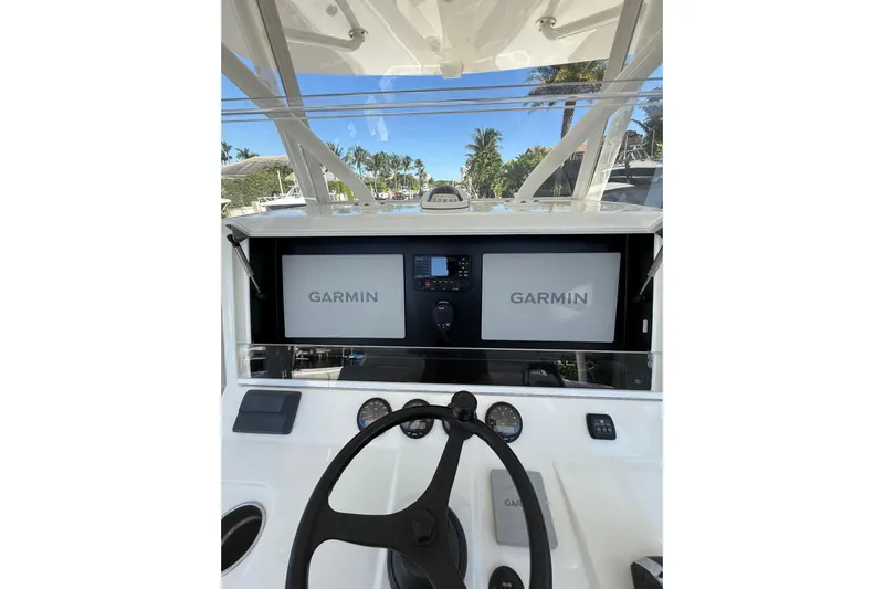  Yacht Photos Pics 2022 SeaVee 370Z boat dashboard with Garmin navigation displays and steering wheel.