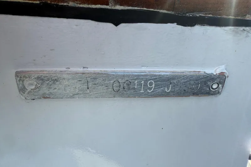  Yacht Photos Pics 1990 Denison Pilothouse Cockpit Motoryacht hull identification plate on white surface.