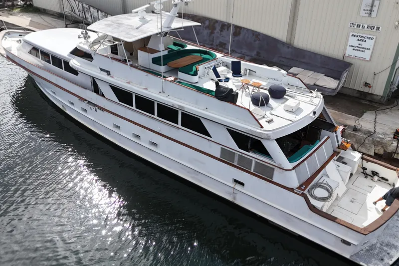  Yacht Photos Pics 1990 Denison Pilothouse Cockpit Motoryacht docked, aerial view showcasing spacious deck and sleek design.