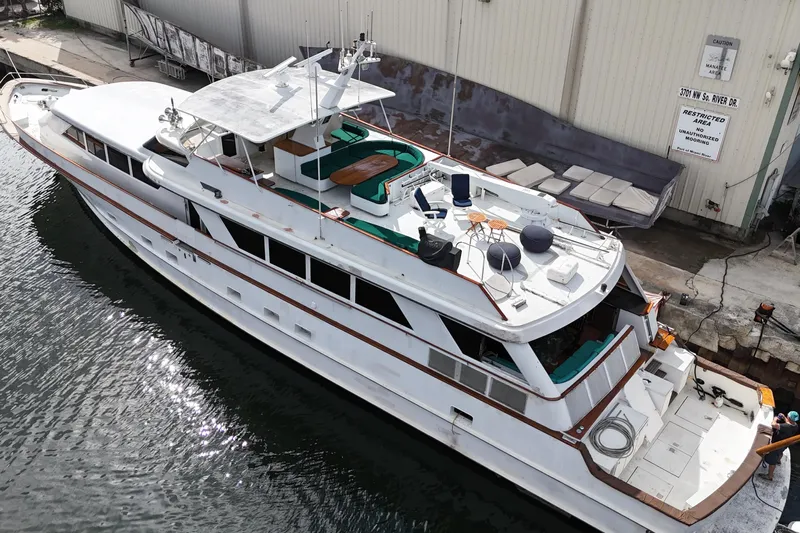  Yacht Photos Pics 1990 Denison Pilothouse Cockpit Motoryacht docked, featuring spacious deck and seating area.