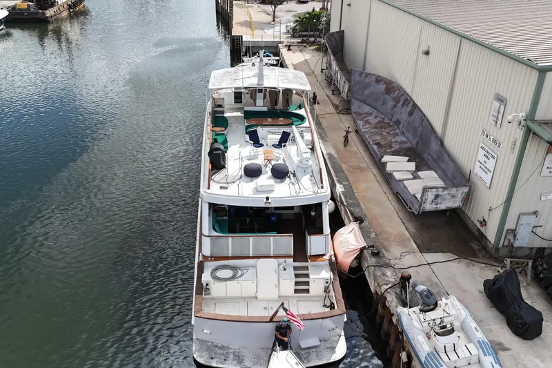  Yacht Photos Pics 1990 Denison Pilothouse Cockpit Motoryacht docked at marina, aerial view.