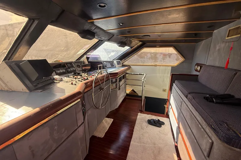  Yacht Photos Pics 1990 Denison Pilothouse Cockpit Motoryacht interior with helm, controls, and seating area.