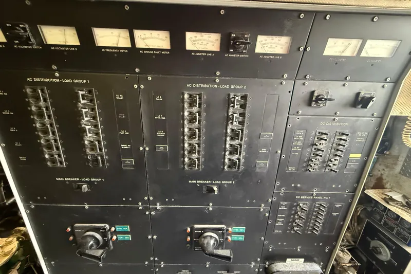  Yacht Photos Pics Electrical control panel of a 1990 Denison Pilothouse Cockpit Motoryacht, featuring various meters and switches.
