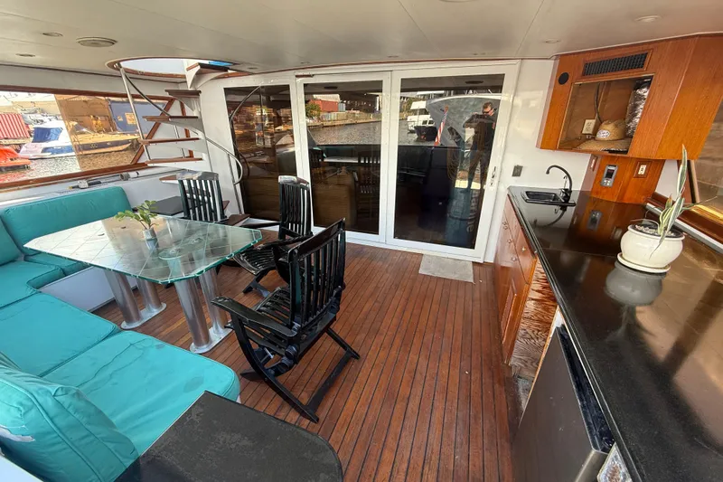  Yacht Photos Pics Luxurious 1990 Denison Pilothouse Cockpit Motoryacht interior with elegant seating and kitchenette.