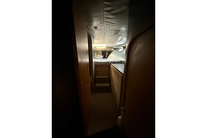  Yacht Photos Pics 1990 Denison Pilothouse Motoryacht interior with cozy cabin and wooden cabinetry.