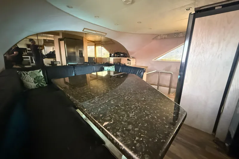  Yacht Photos Pics Luxurious interior of 1990 Denison Pilothouse Cockpit Motoryacht with sleek dining area.