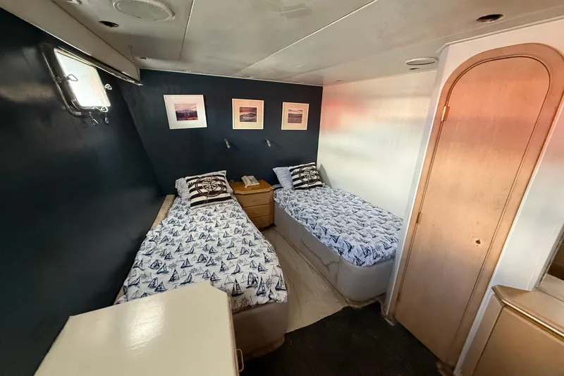  Yacht Photos Pics Twin beds in a 1990 Denison Pilothouse Cockpit Motoryacht cabin, nautical-themed decor.