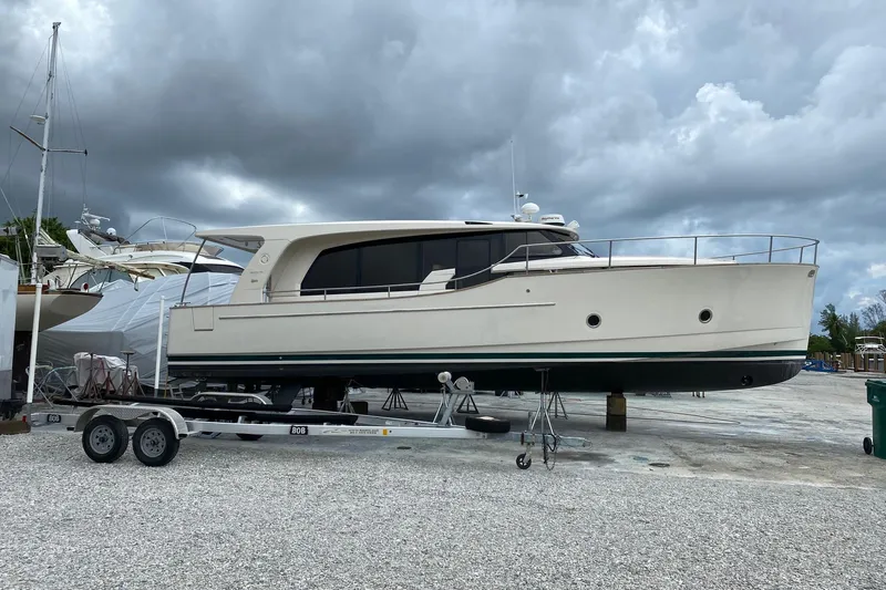 Green Eye Lady Yacht Photos Pics 2019 Greenline 40 yacht on trailer under cloudy sky at marina.