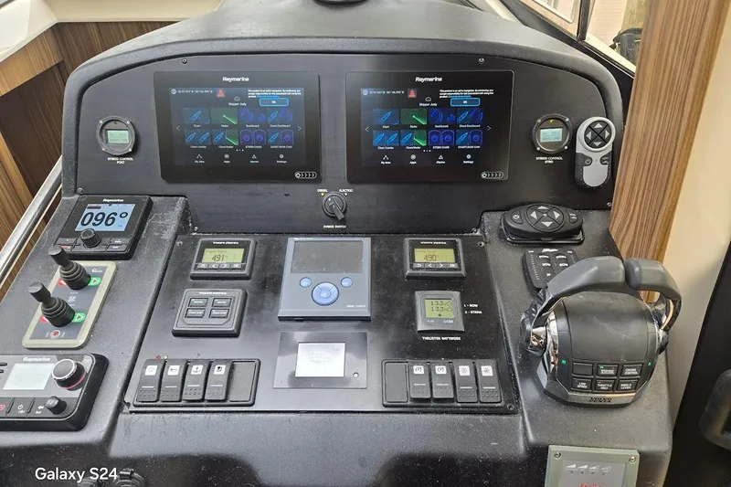 Green Eye Lady Yacht Photos Pics Control panel of a 2019 Greenline 40 yacht with advanced navigation systems.