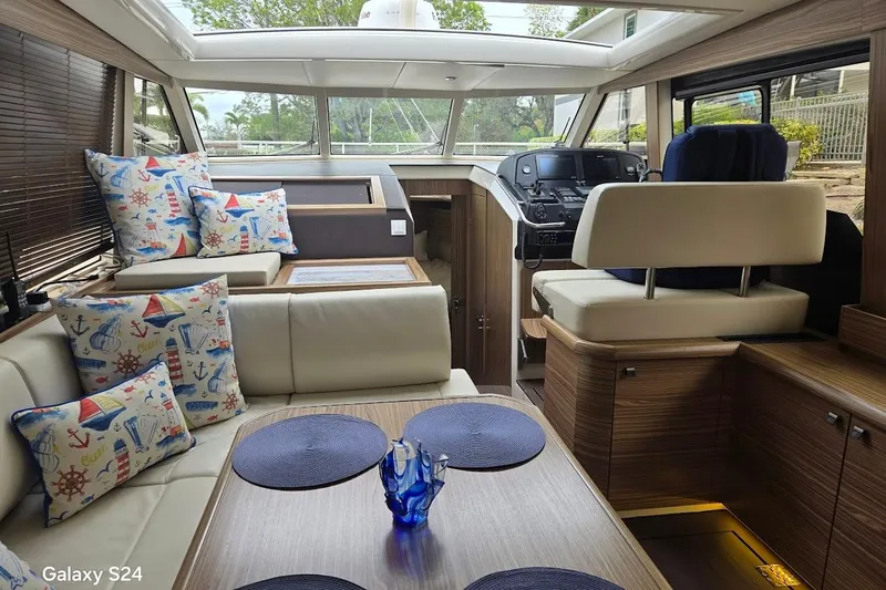 Green Eye Lady Yacht Photos Pics Luxurious interior of 2019 Greenline 40 yacht with nautical-themed decor and modern helm.